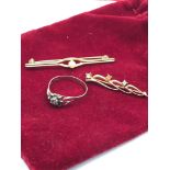 A 9ct gold ladies ring together with 2 costume brooches.