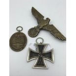 A WW2 German Nazi Westwall Medal, WW2 Iron cross medal & WW2 German Eagle Iron cross