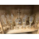 A Victorian crystal decanter together with wine goblets etched with foliage & grape design