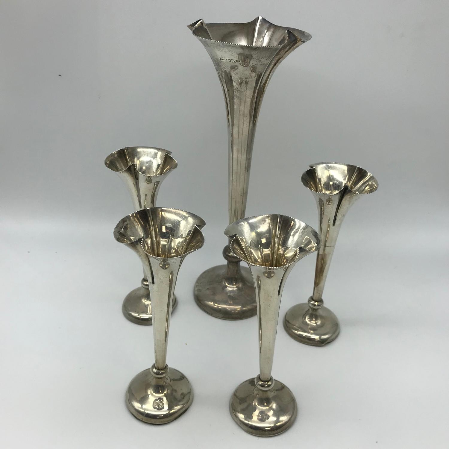 A Large Chester silver bud vase (Weighted) together with 4 Birmingham silver smaller matching bud
