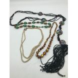 A collection of vintage necklaces, to include tiger eye glass bead necklace, an Egyptian revival