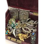 A jewellery box filled with vintage jewellery to incude, belt buckle & brooches etc