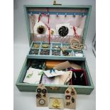 A case filled with various costume jewellery, silver & Masonic pin badges etc