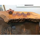 A Chinese tea ceremonial slab together with a seven piece clay saki set