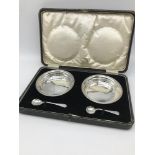 A Boxed pair of Birmingham silver dishes with silver salt and mustard spoons. Makers Lawrence