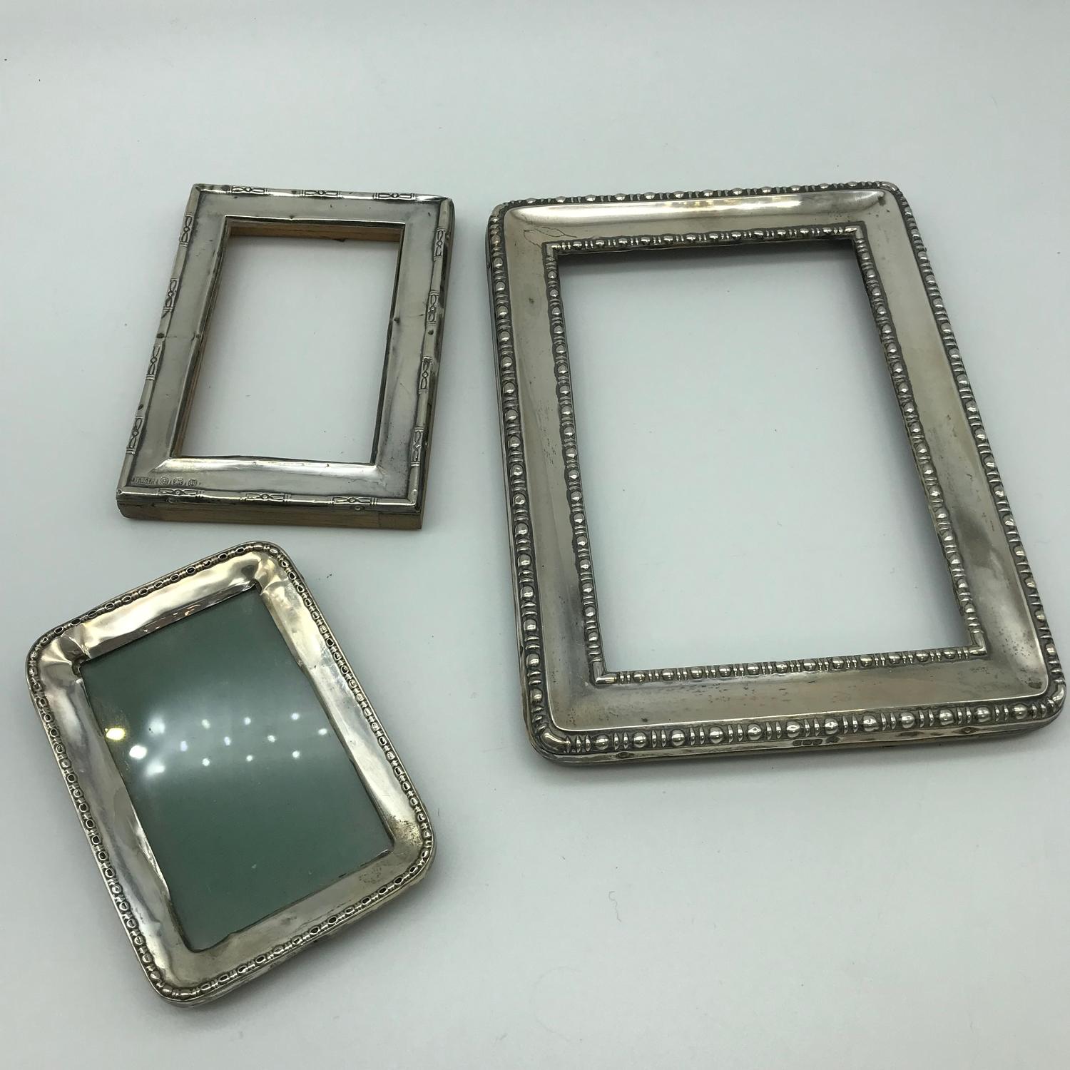 A Lot of 2 Birmingham silver small photo frames & 1 Sheffield silver photo frame. Large Sheffield