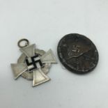 A WW2 German Wound pin bagde & WW2 German Faithful service medal.