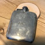 A Sheffield silver hip flask (James Deacon & Sons, 1929). Measures 12.5x9cm