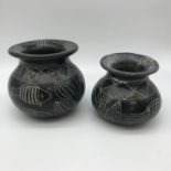 2 Antique graduating Inuit Eskimo soapstone pots, depicting fish. Tallest measures 9cm in height