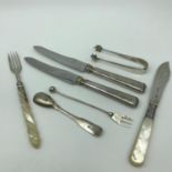 A Lot of Birmingham & Sheffield silver cutlery. Includes mother of pearl handle fork & knife. Also