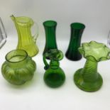 A Lot of early 1900's & Victorian Vaseline green glass jugs and vases. Tallest measures 18cm in