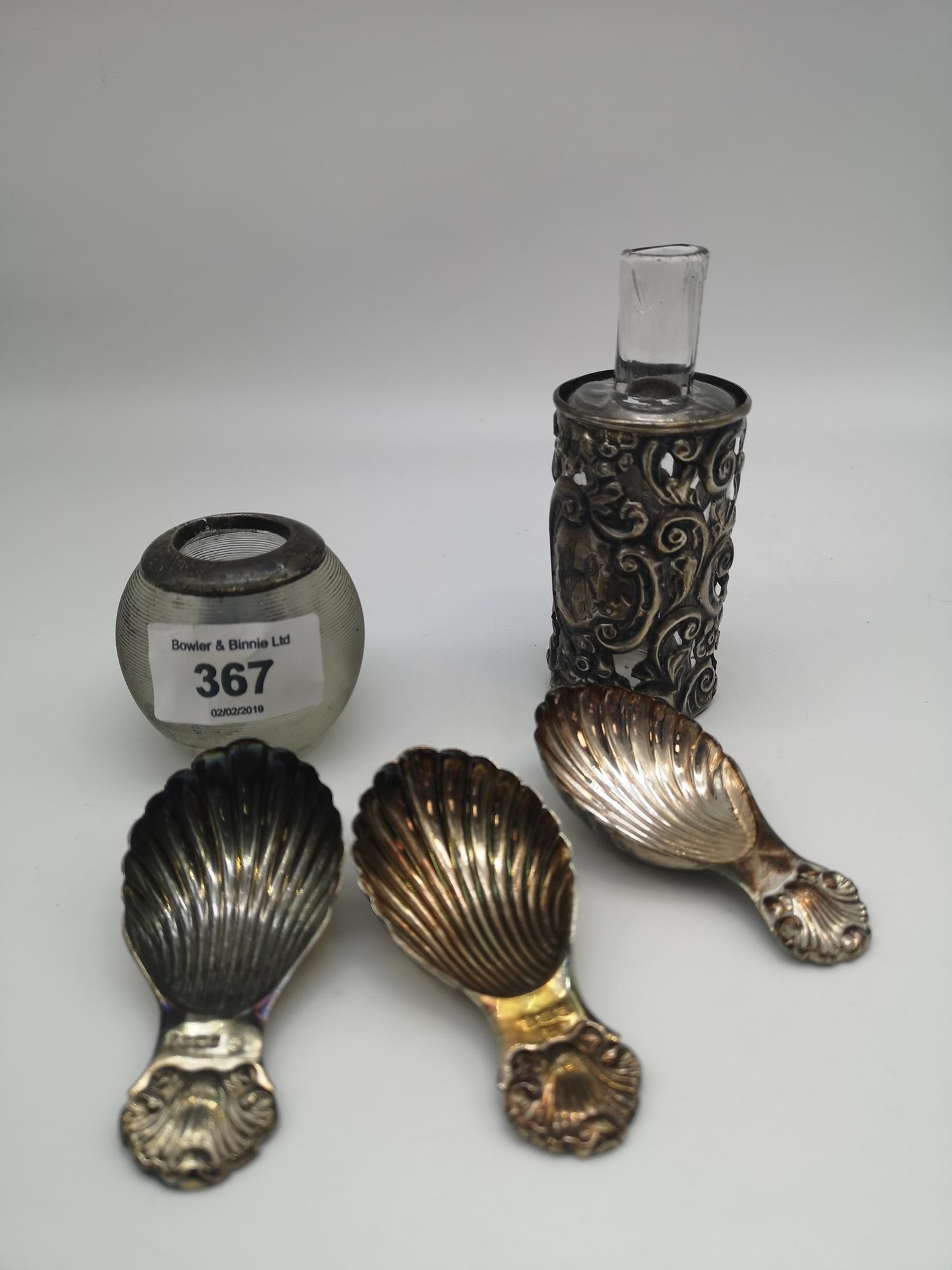 Three Birmingham & Sheffield silver shell design spoons together with a silver collared ink pot