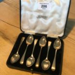 A set of six Sheffield silver spoons within an original Jenners, Edinburgh fitted display case (