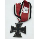 A WW2 Knight's Cross of the iron cross., complete with ribbon