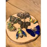 A Lot of vintage silver filigree and silver and enamel butterfly brooches. Includes silver butterfly