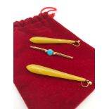 A Victorian 15ct gold ladies bar brooch set with 2 single pearls & centred with a Turquoise stone,