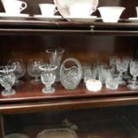 A Shelf of various crystal glasses and vases.