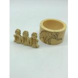 A Meiji period ivory napkin ring engraved with a elephant together with Meiji period ivory geisha