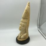 An Early 1900's Ivory carved African tribal lady bust. Measures 28cm in height. Sat upon a