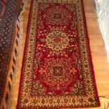 An antique ornate Persian style rug, Measures 184x91cm