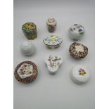 A collection of porcelain lidded trinket boxes to include names such as Mason's, Palissy & Kaiser