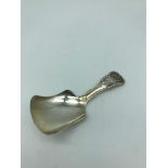 A Silver Birmingham Georgian caddy spoon. Makers Unite & Hilliard, dated 1833.