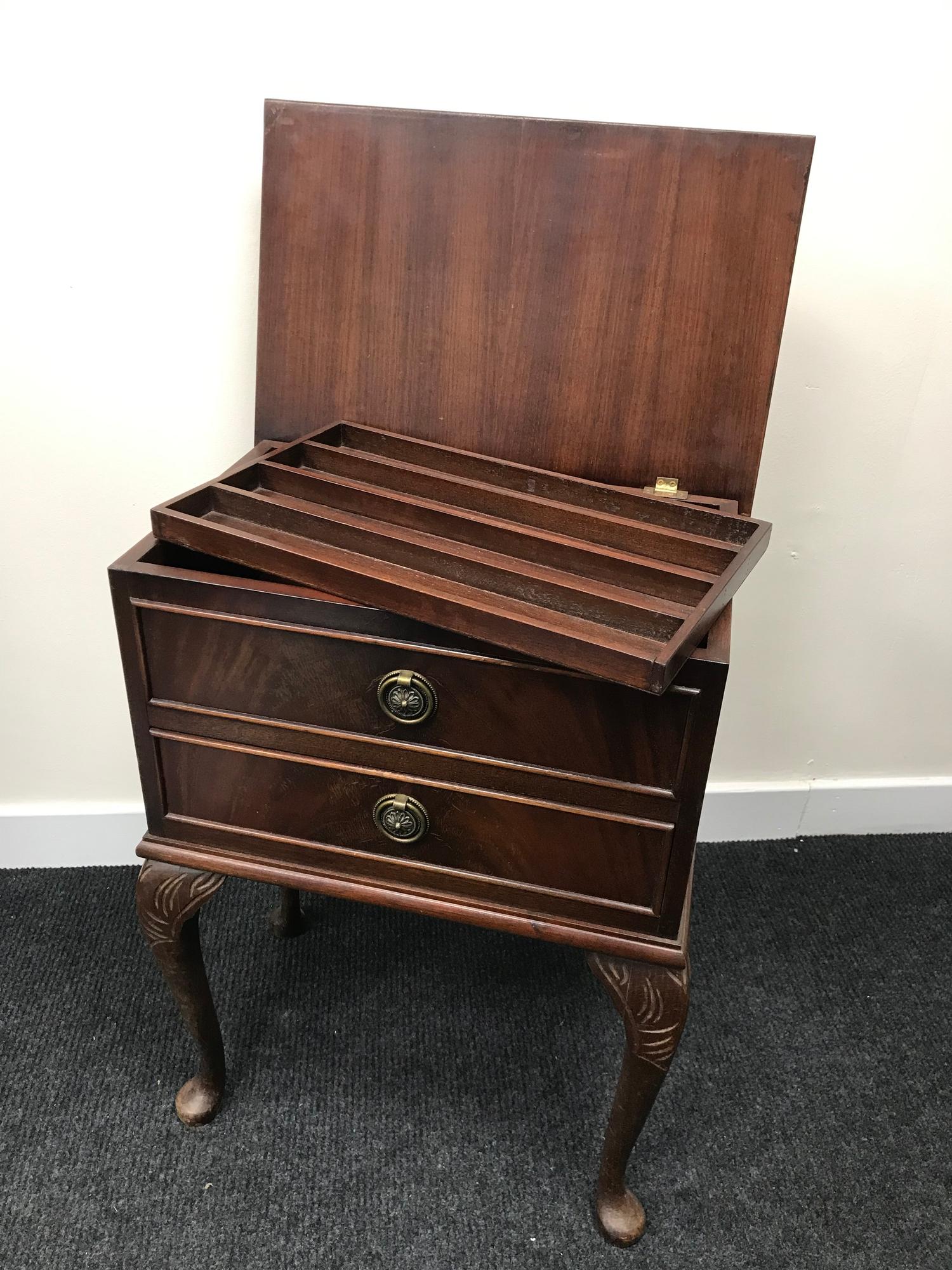 A One drawer sewing table with lift up lid and lift out shelf storage.