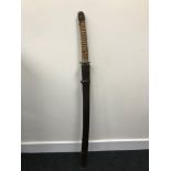 A Mid 20th century Japanese officers Samurai sword. Slight curve to the blade, Bronze tsuba,