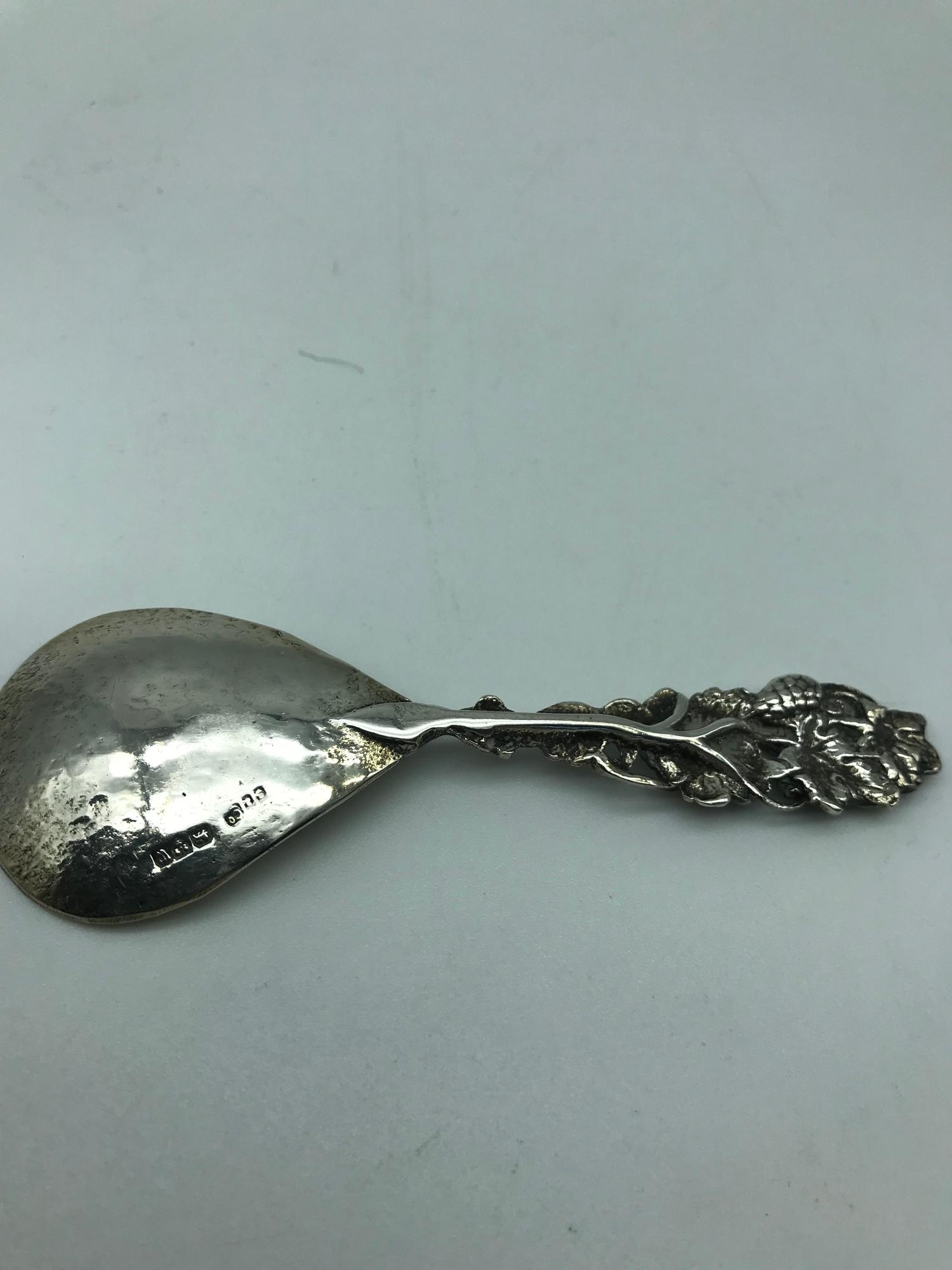 A Chester silver caddy spoon, Makers Shipton & co Ltd, Dated 1922. Designed with a grape/ vine - Image 2 of 2