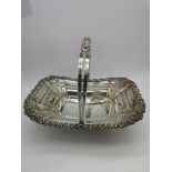 A Georgian Sheffield silver swing handled basket by John Watson & Son (1888), 640 grams in weight