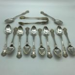 A Set of 12 Victorian Glasgow silver spoons and matching sugar tongs. Ornately designed. Maker