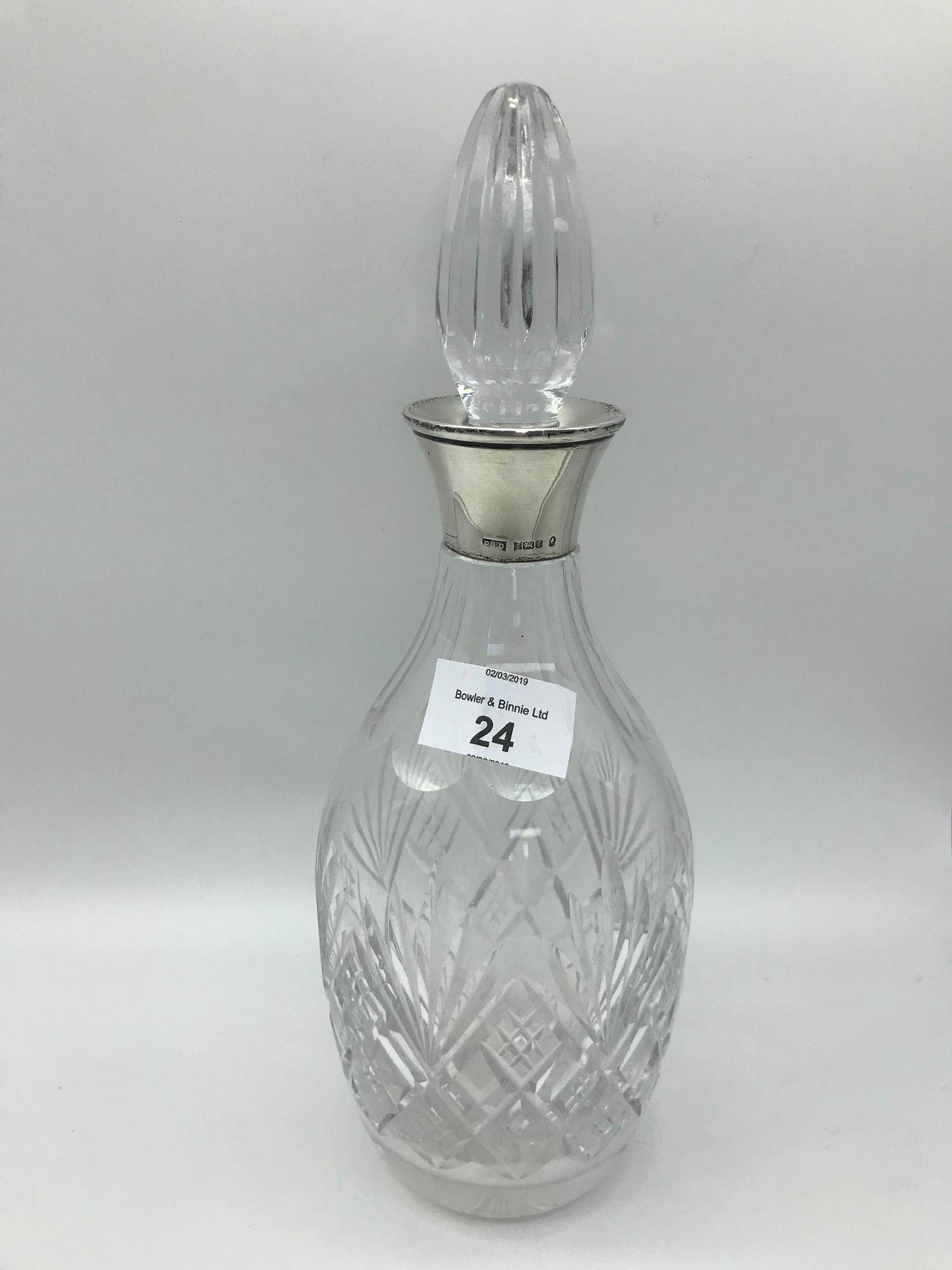 A Birmingham silver collared crystal decanter by Maker Peter John Doherty. Dated 1977. Stands 28.3cm