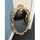 Vintage Oval gilt framed mirror standing 75 cm high and 47 cm wide.