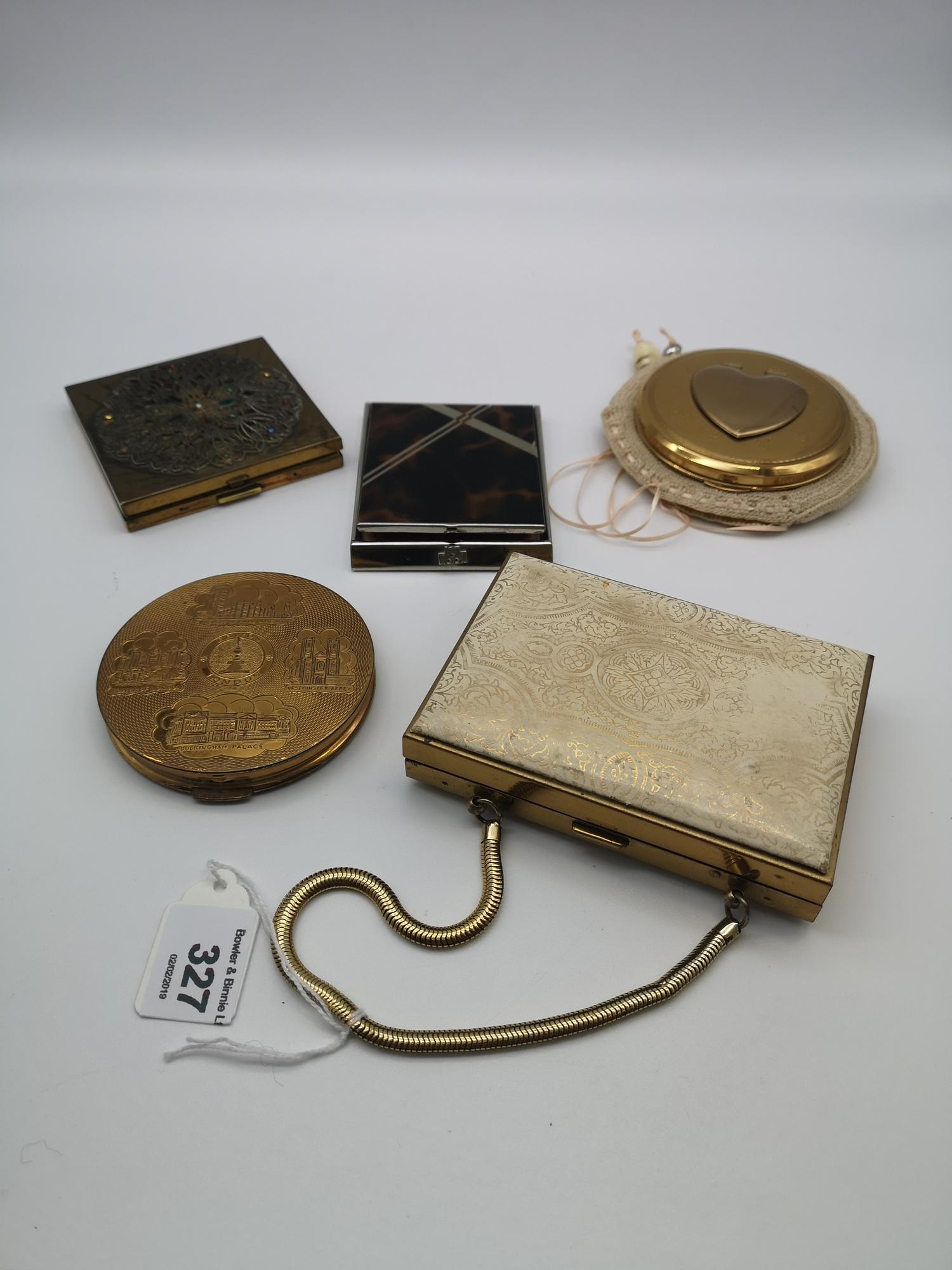 A lot of four vintage powder compacts , together with a vintage handbag combination powder compact/