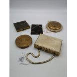 A lot of four vintage powder compacts , together with a vintage handbag combination powder compact/