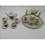 A miniature tea set in the style of Susie Cooper, with tray