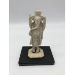An early 1900s hand carved ivory Ganesha god figure with a hardwood stand. Measures 10.5cm in