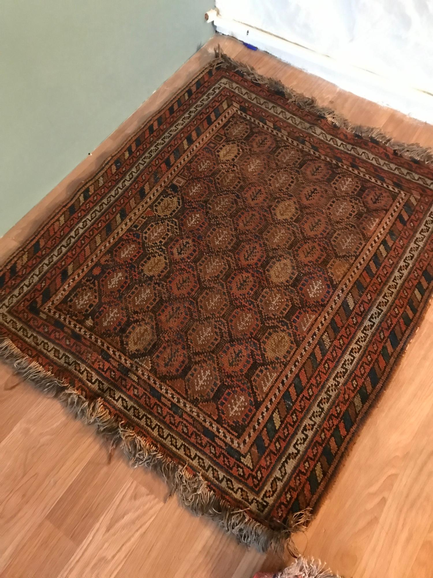 A Small Antique hand woven Indian style rug. Measure 110x97cm