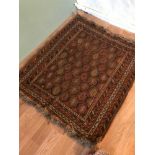 A Small Antique hand woven Indian style rug. Measure 110x97cm