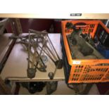 Vintage car jacks along with various other car parts.