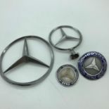 A lot of 4 Vintage Mercedes Benz car badges.