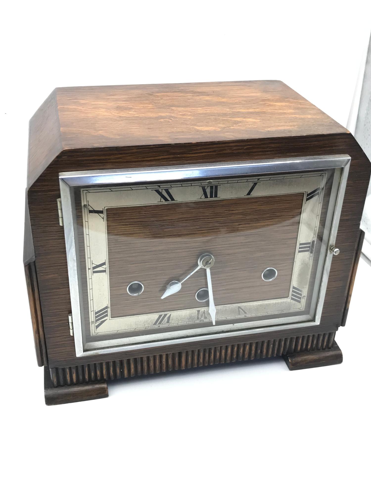 An Art Deco Norland mantel clock with key and pendulum. Running.