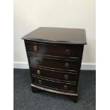 A Small 4 drawer bow front chest. Measures 59.5x45.5x35.5cm