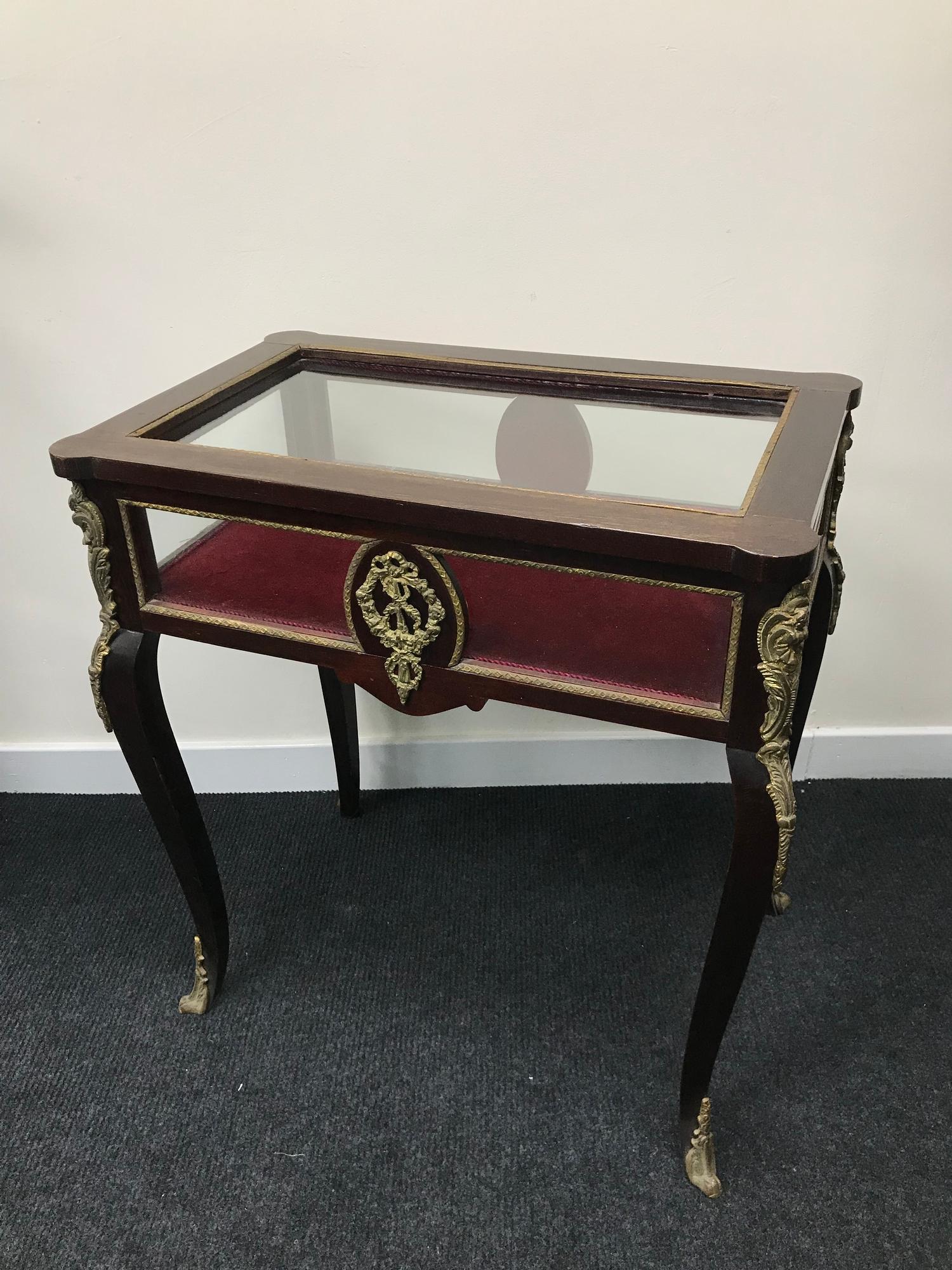 French style jewellery cabinet, styled with brass gilt trims and facers, supported on cabriole legs.