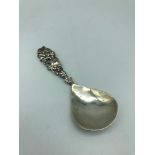 A Chester silver caddy spoon, Makers Shipton & co Ltd, Dated 1922. Designed with a grape/ vine