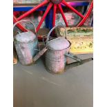 Two vintage watering cans