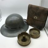 A WW2 British helmet, 2 WW2 trench art items and leather satchel bag.