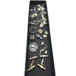 A lot of silver jewellery which includes silver charms (Queens head) silver Girls academy viking
