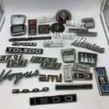 A Lot of vintage motoring car badges includes Fiat, Vogue and others