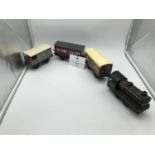 Vintage clockwork train marked 67040, with LMS guards carriage, goods and passenger carriages and